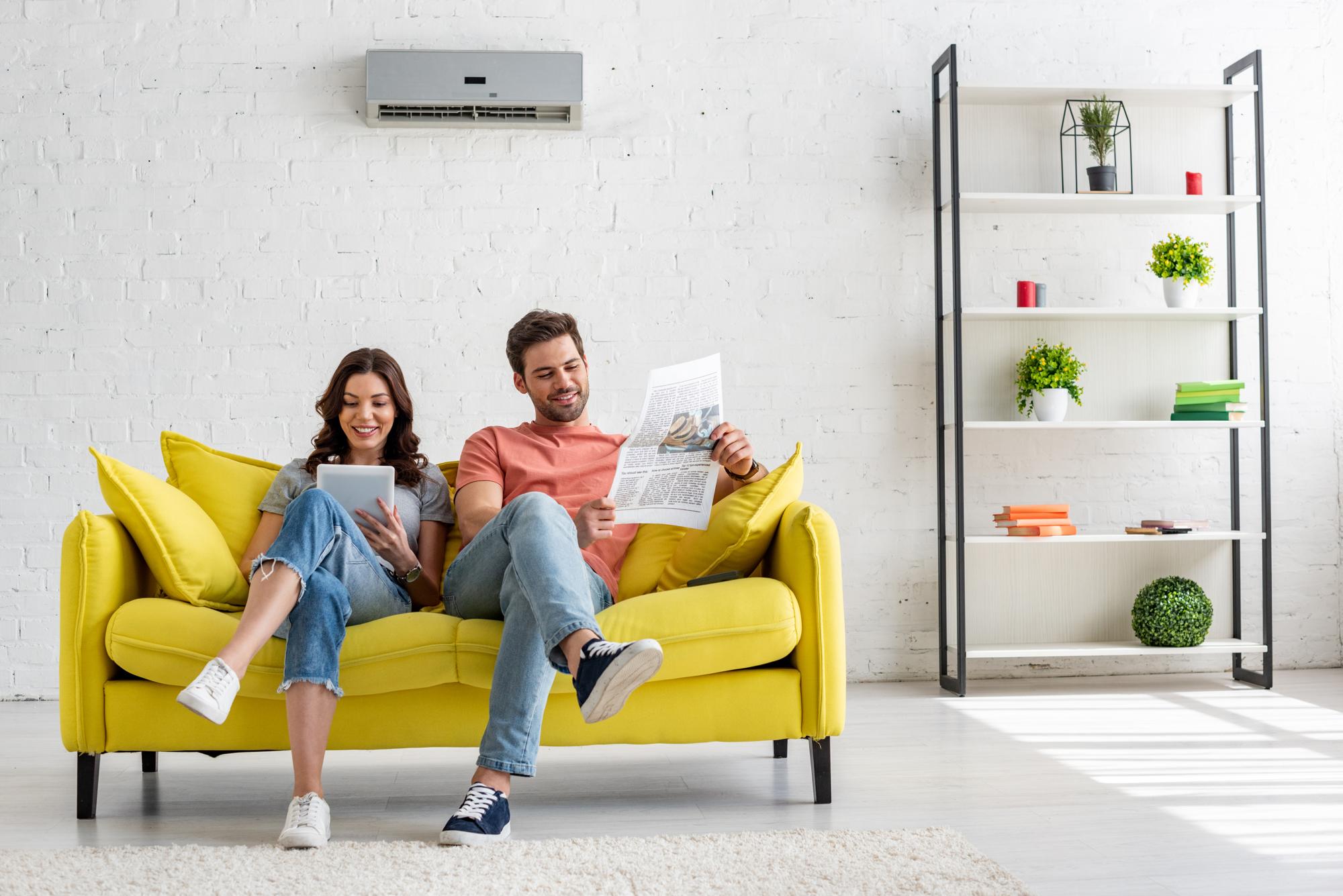 Couple in living room with split system